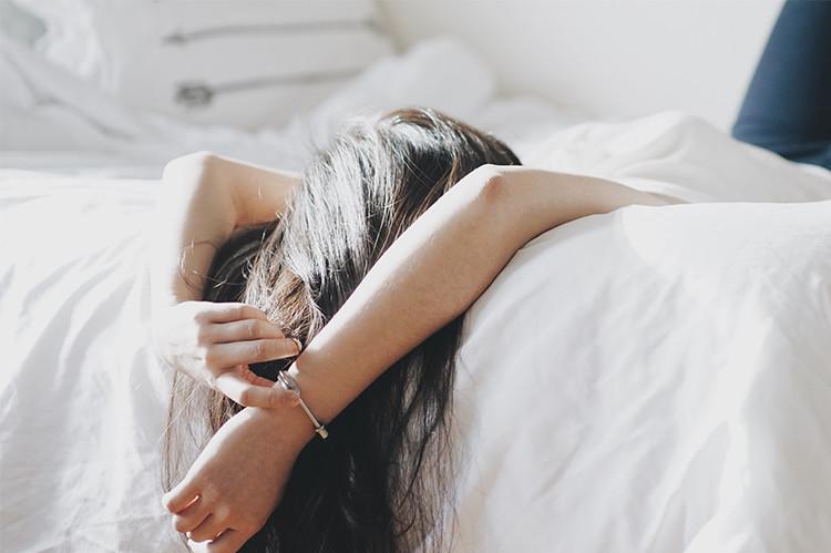 Woman sleeping with legs high