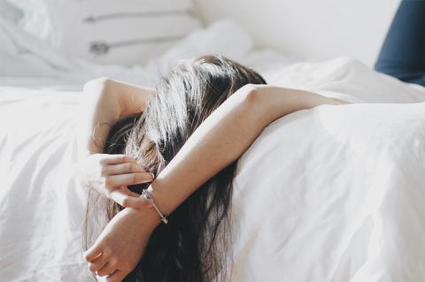 Woman sleeping with legs high