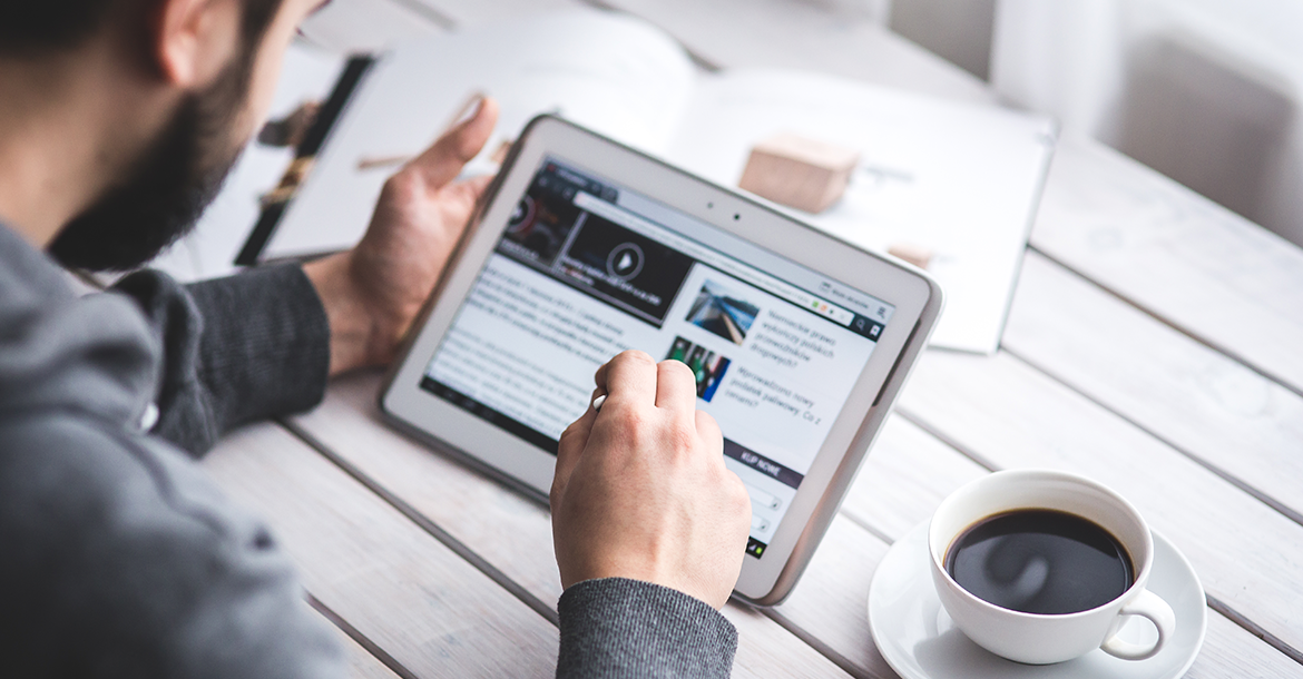 Man searching online, on his tablet