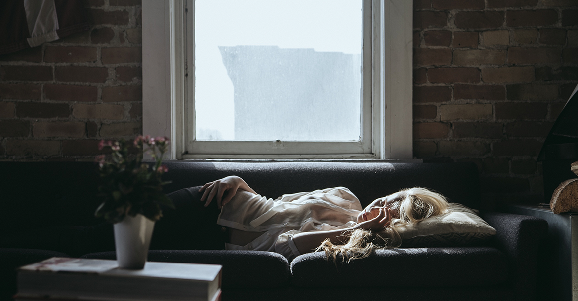 Woman sleeping next to the window